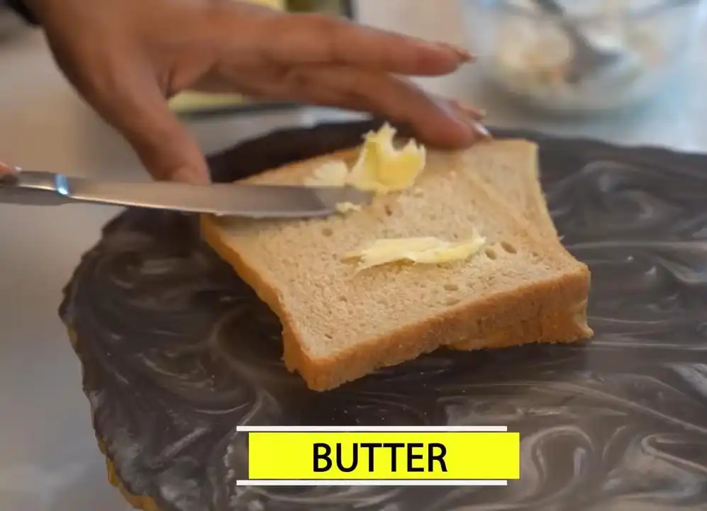 applying butter on bread