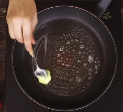 applying butter on pan