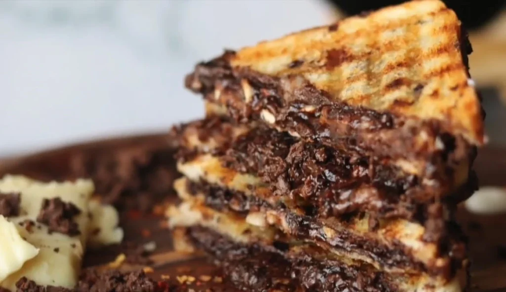 chocolate cheese sandwich with melted chocolate inside it 