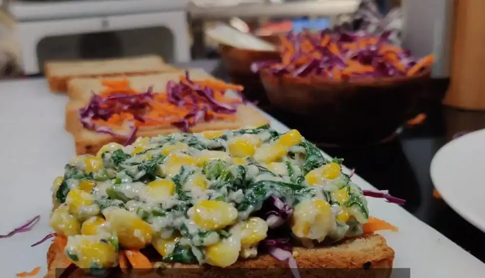 spreading stuffing on bread slice