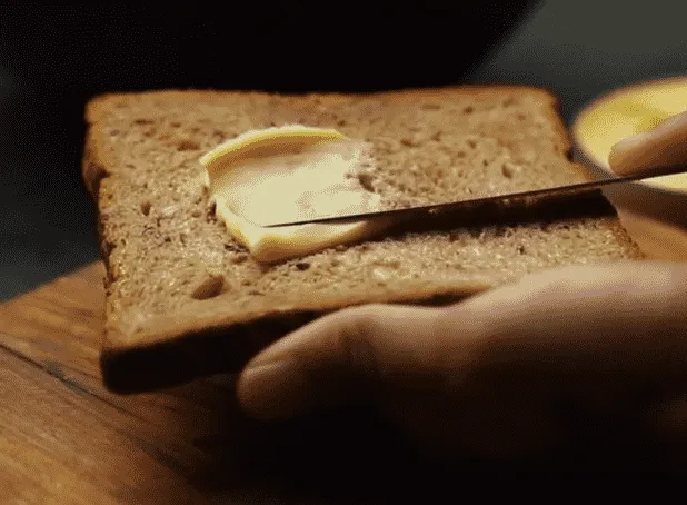 applying butter on bread