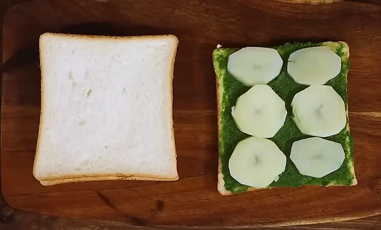 placing boiled potato on sandwich