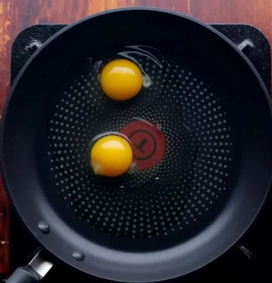 break the egg in pan