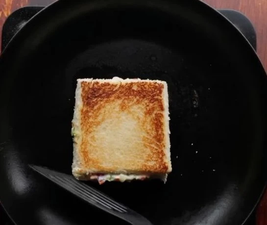 cooking sandwich in pan