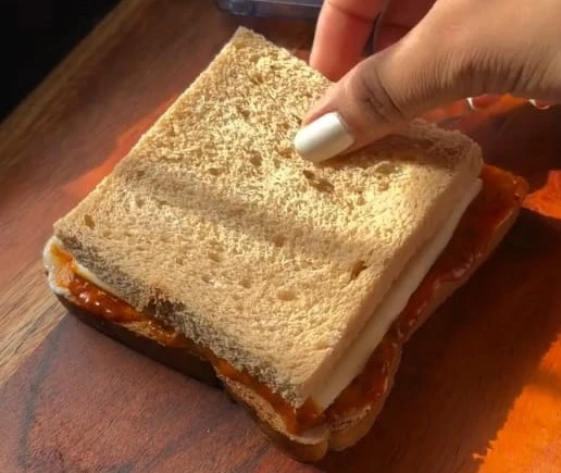 cover the sandwich with another slice of bread