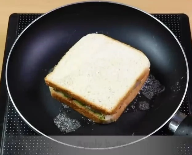 place sandwich in pan