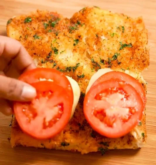 place two slices of tomato